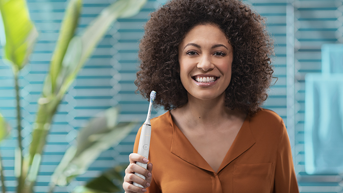 Smiling with toothbrush