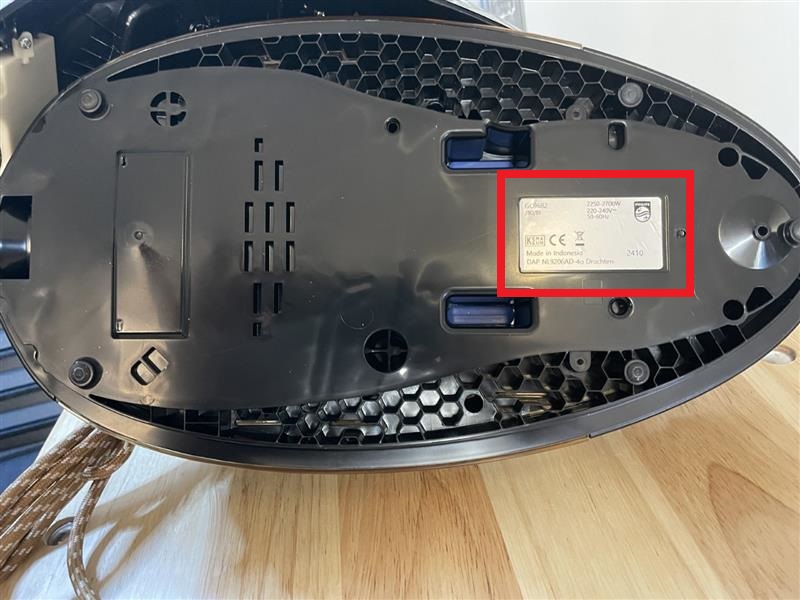 Steamer plate that shows the product model number and the code number