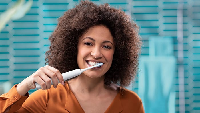 Woman brushing teeth